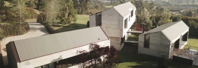 concrete home with three connected volumes