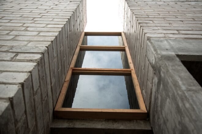large windows on a brick home