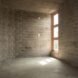 room with compressed earth brick walls