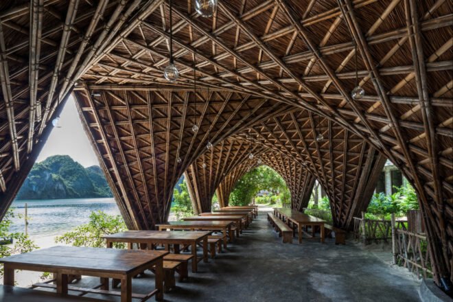 open-air, covered seating area with thatched ceiling