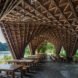 open-air, covered seating area with thatched ceiling