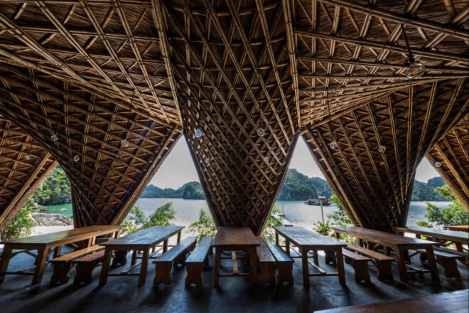 open-air, covered seating area with thatched ceiling