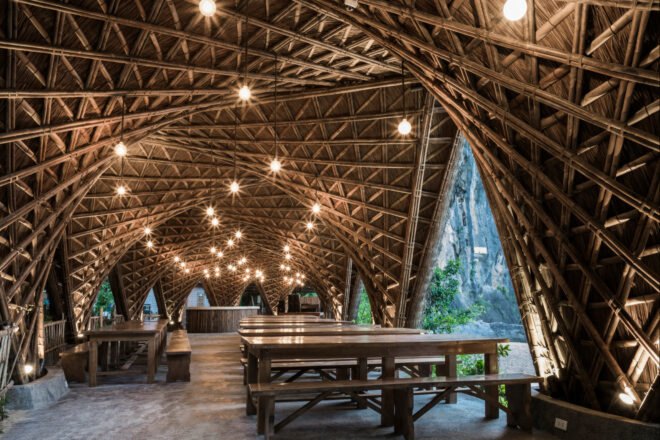 open-air, covered seating area with thatched ceiling
