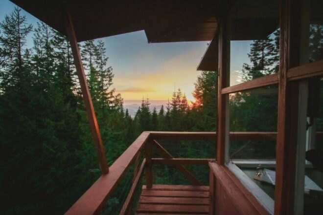 open-air deck with views of the sun setting