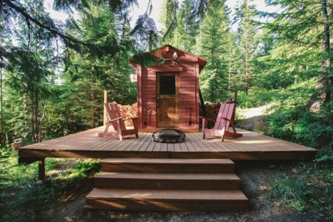 tiny hut with pitched roof and outdoor deck