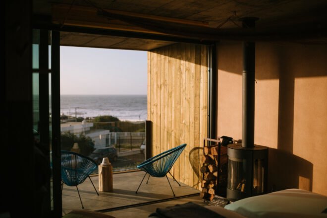 image of living space with sliding glass doors leading out to a patio