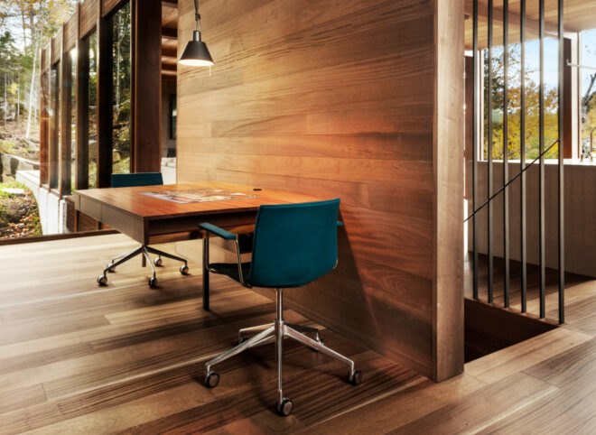 small office space with wooden walls and flooring