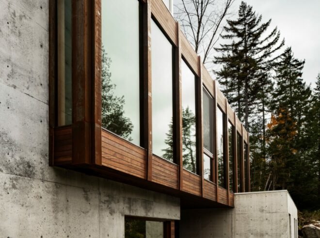 exterior of home with wooden windows on a concrete facade