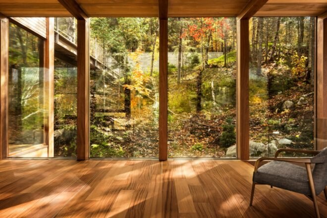 room with wood floors and glass walls