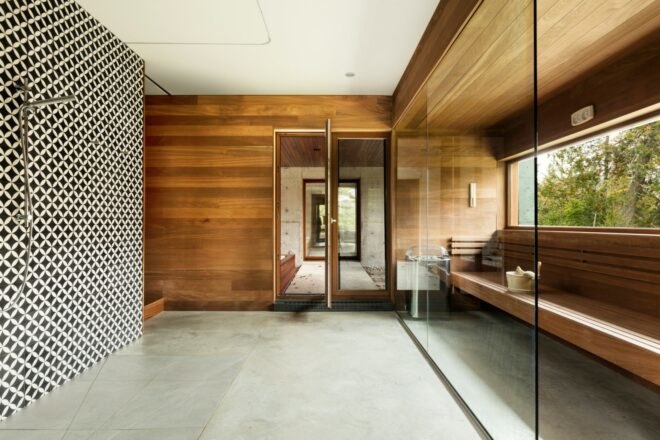 interior of home with concrete flooring and wooden walls