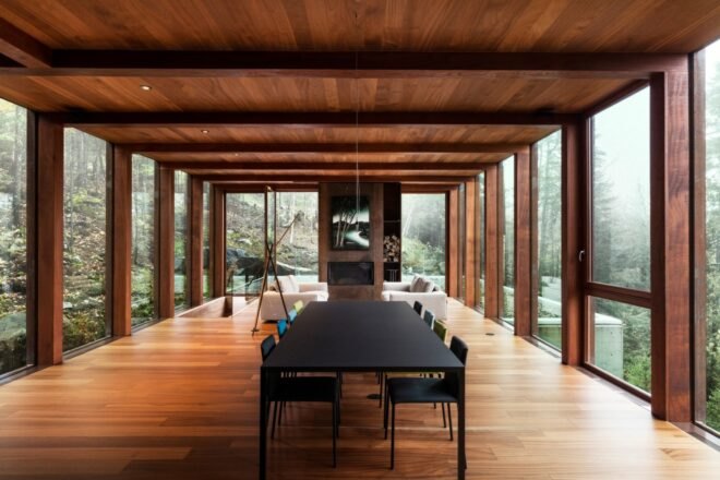 dining table surrounded by large glass panels