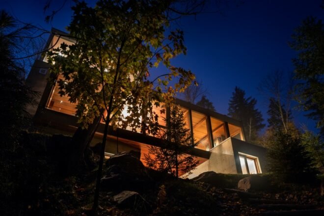 home with multiple levels lit up at night