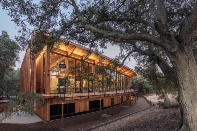 wooden building illuminated with lights during sunset
