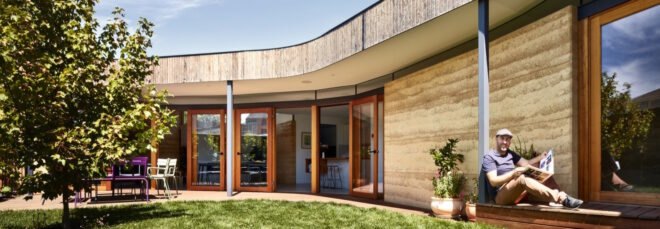curved home with rammed earth walls