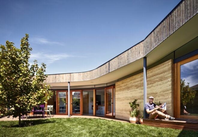 curved home with rammed earth walls