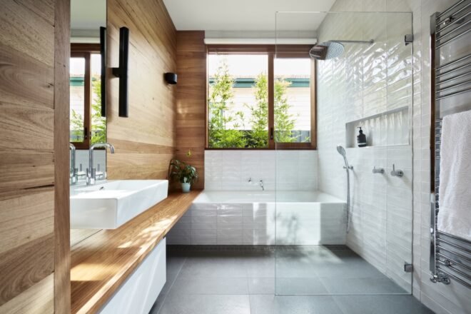 white bathroom with rammed earth walls