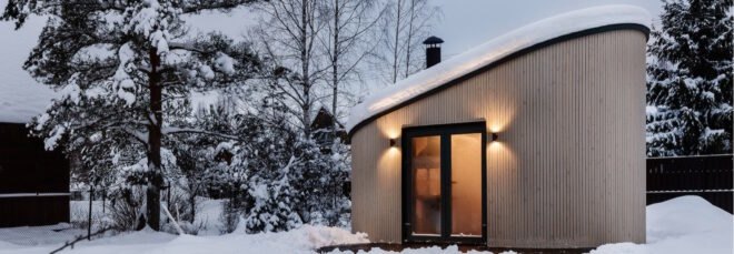 tiny house surrounded by snow