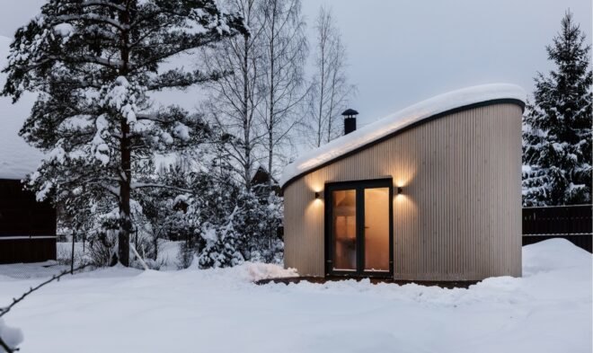 tiny house surrounded by snow