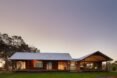 wood farmhouse with gabled roofs