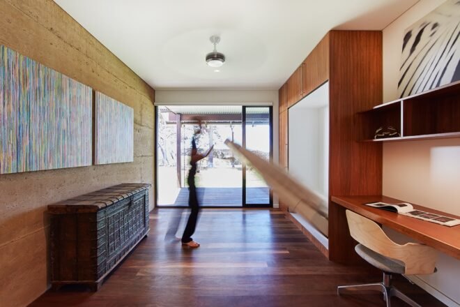 person flipping a bed down from the wall