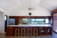 kitchen with dark wood cabinets and white countertops