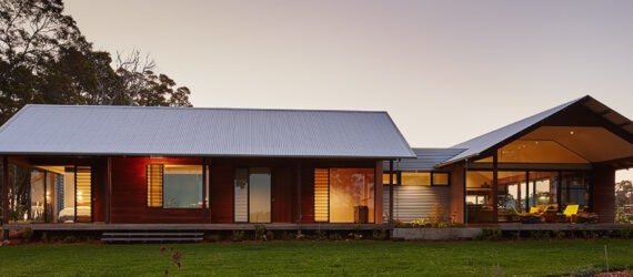 wood farmhouse with gabled roofs