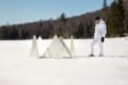 a round series of triangular panels on a snowy landscape