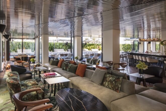 dining area with couches, chairs and tables