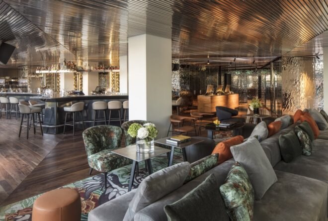 lounge area with bar seats and couches