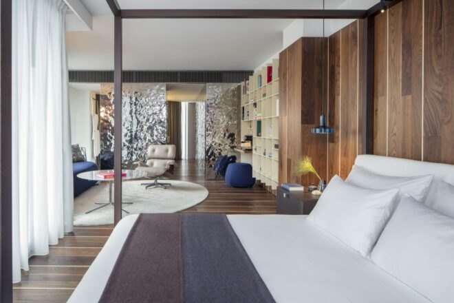 bedroom with wood walls
