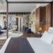 bedroom with wood walls