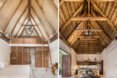 tan bedroom with tall, pitched ceilings