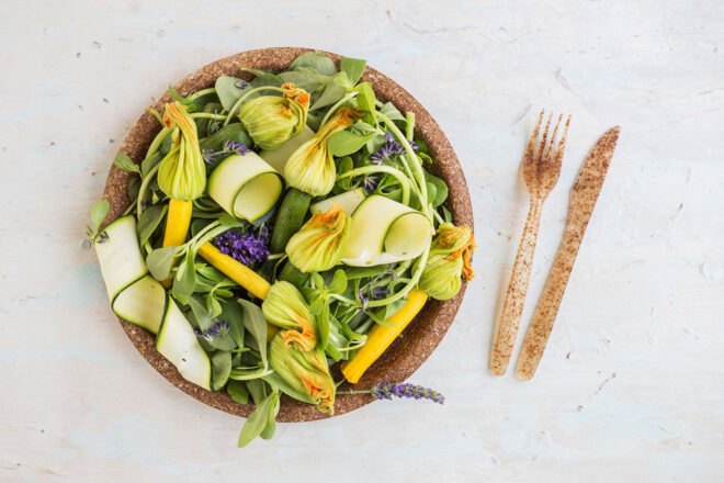 brown biodegradable tableware with colorful salad on plate