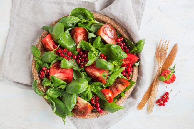 brown biodegradable tableware with colorful salad on plate