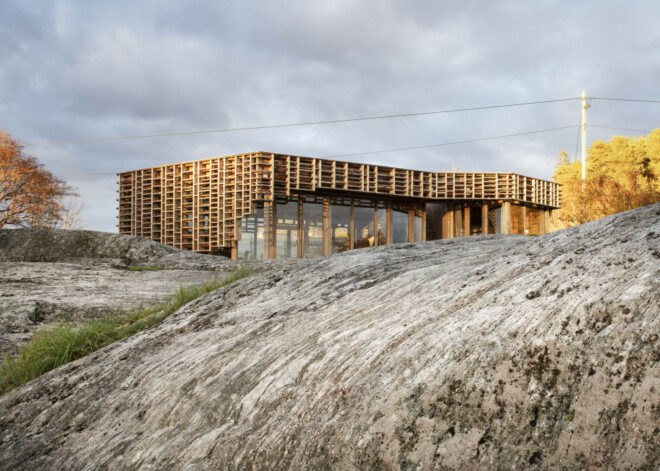 home wrapped in timber slats on rocky landscape