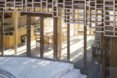 home wrapped in timber slats with concrete stairs
