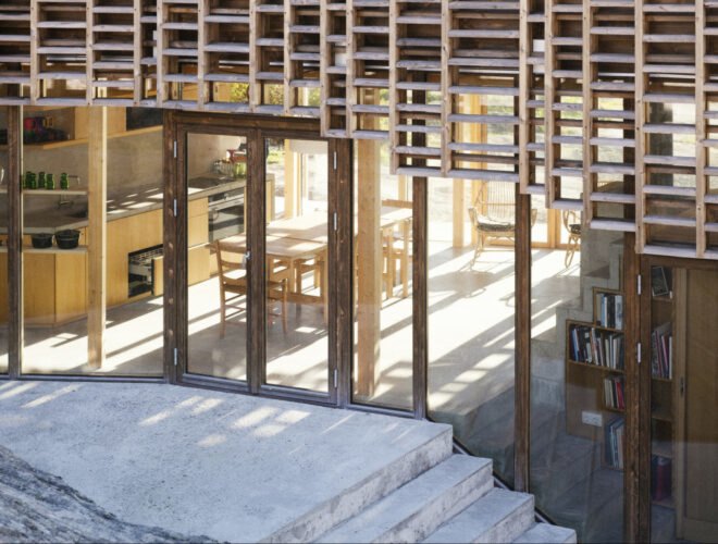 home wrapped in timber slats with concrete stairs