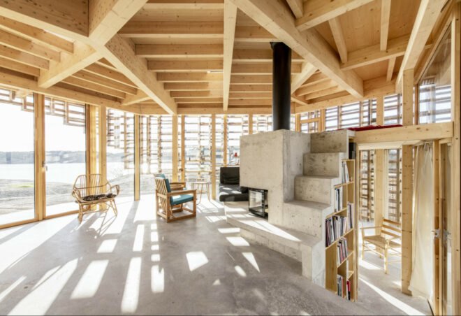 interior living space with wooden beams and concrete flooring