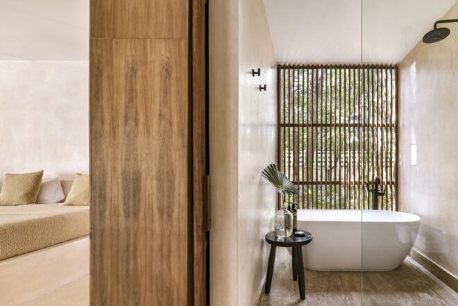 freestanding bathtub in front of wooden screens