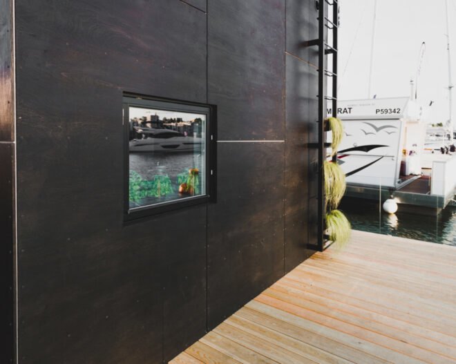 cube-like tiny home set on floating platform