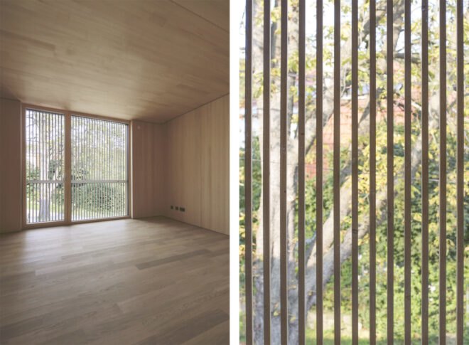 bedroom with wood floors and walls with floor to ceiling window