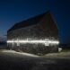 white LED light in middle of stone building