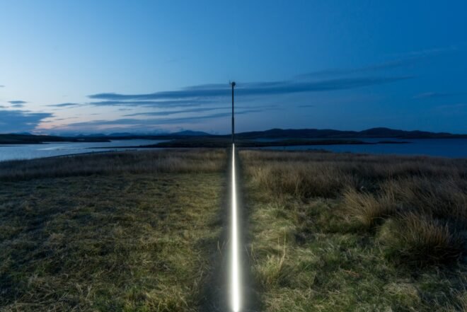 white line in the middle of grassy field