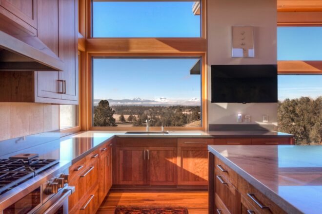 kitchen with large windows and wood cabinets and island