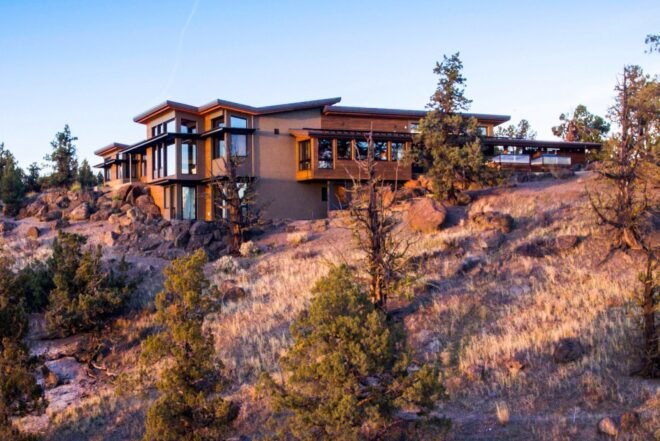 house on hill top over looking scenic landscape