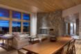 interior living and dining room of the home with wooden table and ceiling