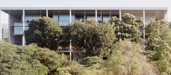 SDE4 building surrounded by large green trees