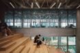 students sit on wood stairs