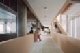 interior of building with students walking through hallways and stairwells
