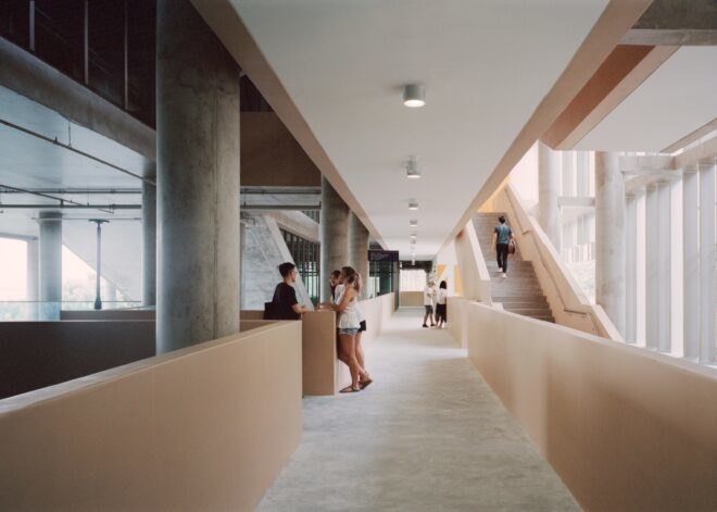 interior of building with students walking through hallways and stairwells